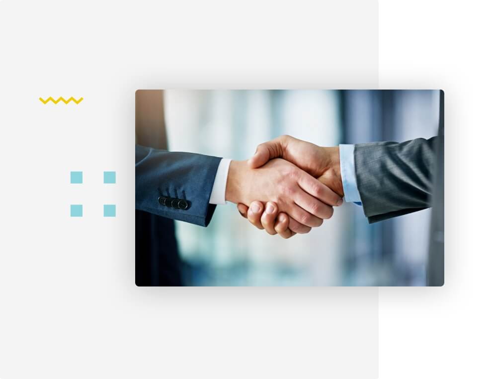 Image of two men shaking hands